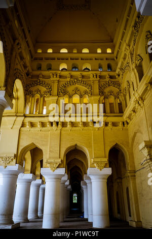 Columns and arches in one of the corridors surrounding main courtyard of 17th-century Thirumalai Nayak Palace, Madurai, Tamil Nadu, India. Stock Photo