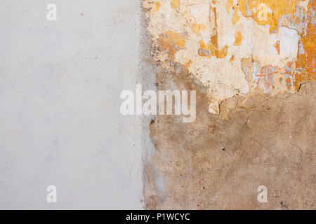 Beige new plastered wall with damaged old painted wall background Stock Photo