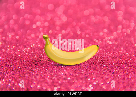 Colorful fruit pattern of fresh yellow bananas on pink background. From top view Stock Photo