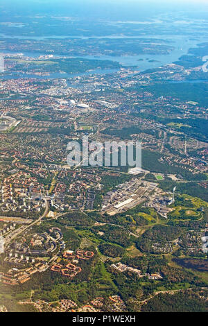 STOCKHOLM, SWEDEN - JUNE 1, 2018: Aerial shot over Stockholm with landmarks Stockholm Globe and Tele2 Arena during inflight to Arlanda airport on a su Stock Photo