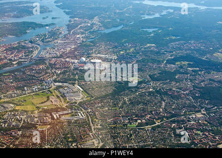STOCKHOLM, SWEDEN - JUNE 1, 2018: Aerial shot over Stockholm with landmarks Stockholm Globe and Tele2 Arena during inflight to Arlanda airport on a su Stock Photo