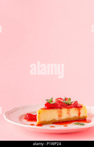 Delicious homemade cheesecake with strawberries on pink background. Stock Photo