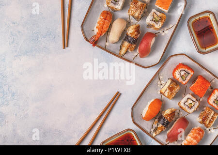 Sushi Set: sushi and sushi rolls on plate, top view. Stock Photo