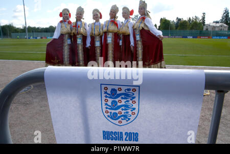 Women pose for a photo in traditional Russian clothing ahead the training session at the Spartak Zelenogorsk Stadium, Repino. Stock Photo