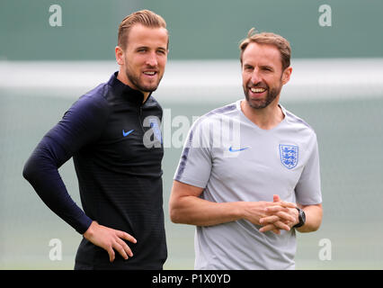 England's Harry Kane (left) with manager Gareth Southgate during the training session at the Spartak Zelenogorsk Stadium, Repino. Stock Photo
