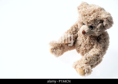 Toys present concept. Teddy bear isolated with copy space on white background Stock Photo
