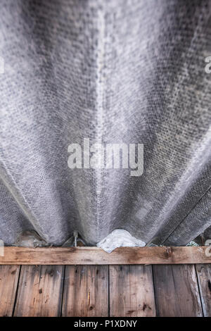 Old corrugated asbestos roof in an old shed Stock Photo