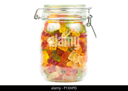Colourful gummy bears / jelly baby candy sweets in a glass jar on a white background Stock Photo