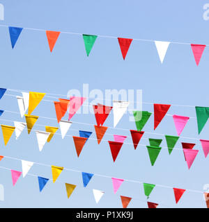 colorful triangle flag with beautiful sky background Stock Photo - Alamy