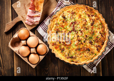 Homemade quiche lorraine with bacon and cheese. French cuisine Stock Photo