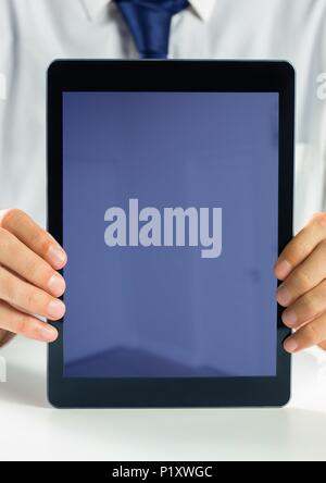 Holding blank screen tablet with businessman Stock Photo