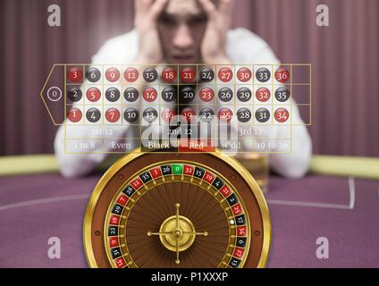 Roulette interface and stressed anxious man in casino Stock Photo