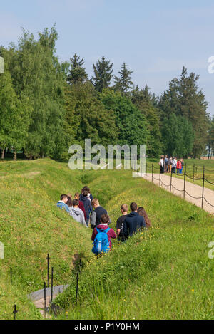 Visitors walking through preserved trench in Newfoundland Memorial Park, near Beaumont-Hamel, Somme, France Stock Photo