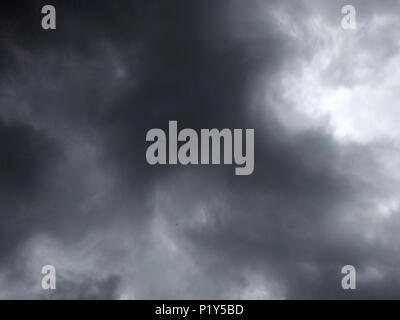 dark dense gloomy dramatic thundercloud on summer day Stock Photo