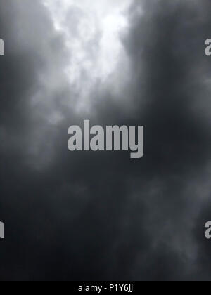 dark dense gloomy dramatic thundercloud on summer day Stock Photo