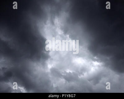 dark dense gloomy dramatic thundercloud on summer day Stock Photo
