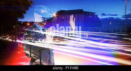 Composite image of businessman using virtual reality headset Stock Photo
