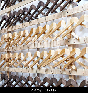 Empty wooden hangers in the store Stock Photo