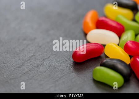 Jelly beans candy sweets on dark background Stock Photo