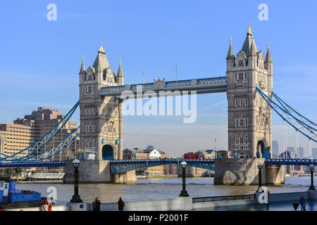 Tower Bridge against the winter blue sky. The bascule and suspension bridge crosses the River Thames and has become an iconic symbol of London. Stock Photo