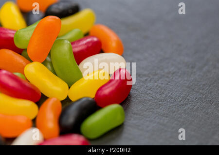Jelly beans candy sweets on dark background with copy space Stock Photo