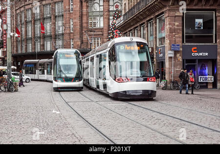 Strasbourg, France - December 28, 2017 : electric tram train of the Strasbourg public transport company (CTS) running on a street in the city on a winter day Stock Photo