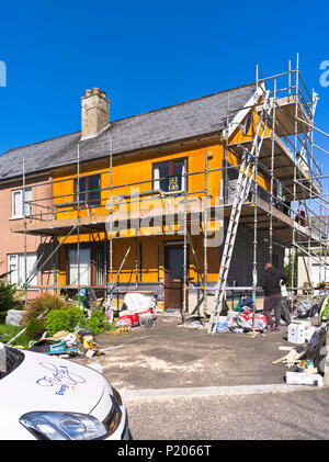 dh Heating Wall insulation BUILDING UK External thermal insulating exterior foam facade outside house walls home installation Stock Photo