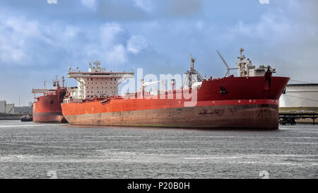 Red oil tanker moored at an oil terminal in the Port of Rotterdam Stock Photo