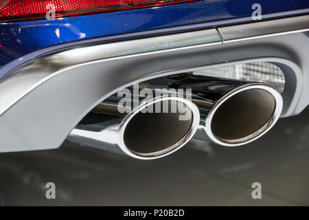 Chrome exhaust pipes on a sports car Stock Photo