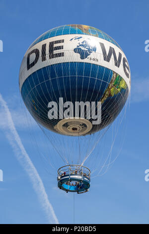 BERLIN, GERMANY - APRIL 28, 2018: Hot air balloon Weltballon HiFlyer near Checkpoint Charlie for a great view over the city centre of Berlin. Stock Photo