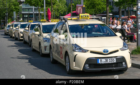 BERLIN, GERMANY - APRIL 28, 2018: German taxi cabs waiting near the Brandenburg Gate. Stock Photo