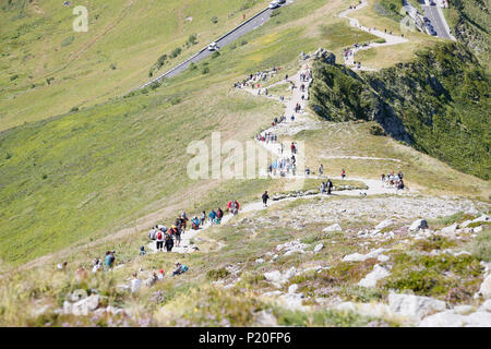 The Massif Central. Cantal. View of tourists going up from the top of the Puy Mary. Stock Photo
