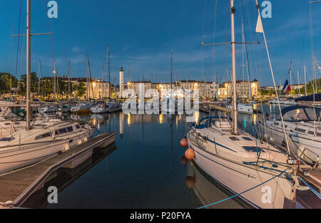 France, Charente-Maritime, La Rochelle, sailing boats on the Bassin a Flot in front of quia Valin at night