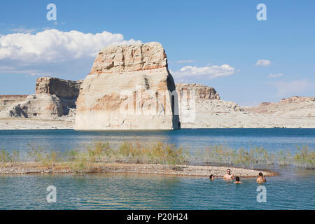 USA. Arizona. Lake Powell. Lone Rock. Americans bathing in the lake. Stock Photo