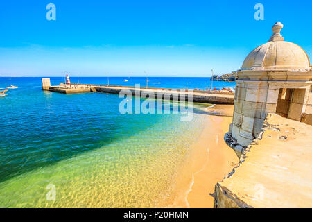 Aerial view of Farol de Lagos Molhe Este and Praia do Cais da Solaria from top of Fort of Ponta da Bandeira. Tower of the fort in Lagos, Algarve, Port Stock Photo