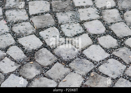 Street of cobblestones close up with gravel inbetween Stock Photo