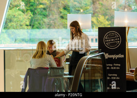 Graz, Austria - October 23, 2017: Interior of a cafe or restaurant in a shopping center with waitresses Stock Photo