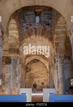 Visitor at Basilica of St Lucia del Trampal. Main nave view Stock Photo