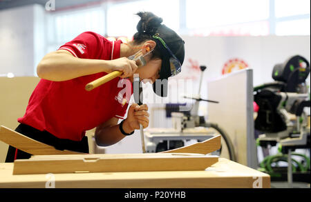 (180613) -- SHANGHAI, June 13, 2018 (Xinhua) -- A competitor processes wood during the national selection match of the 45th Worldskills Competition in Shanghai, east China, June 13, 2018. About 900 competitors of 46 representative teams from across China will take part in the national selection match here.   (Xinhua/Fang Zhe) (zwx) Stock Photo