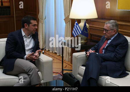 Athens, Greece. 13th June, 2018. Greek Prime Minister Alexis Tsipras (L) talks with European Stability Mechanism (ESM) chief Klaus Regling in Athens, Greece, June 13, 2018. Greece can become a new success story for Europe after facing a severe financial crisis, ESM chief Klaus Regling said on Wednesday in Athens. Credit: Marios Lolos/Xinhua/Alamy Live News Stock Photo