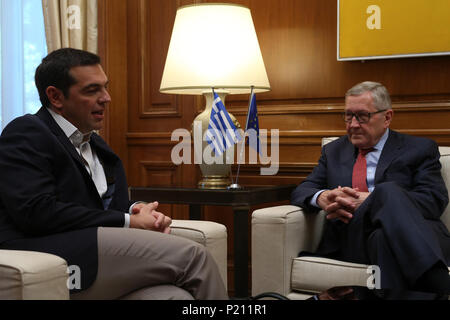 Athens, Greece. 13th June, 2018. Greek Prime Minister Alexis Tsipras (L) talks with European Stability Mechanism (ESM) chief Klaus Regling in Athens, Greece, June 13, 2018. Greece can become a new success story for Europe after facing a severe financial crisis, ESM chief Klaus Regling said on Wednesday in Athens. Credit: Marios Lolos/Xinhua/Alamy Live News Stock Photo