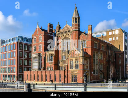 Red brick Victorian house with mullioned windows and golden ornaments at Victoria Embankment street, London Stock Photo