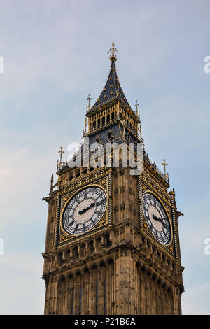 A view of the famous London neo-gothic landmark, the Clock Tower, or Elizabeth Tower, more widely known as Big Ben, against a blue and cloudy sky. Stock Photo