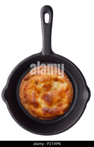 Food: single round toast with grilled cheese on a black ironcast frying pan, isolated on white background Stock Photo