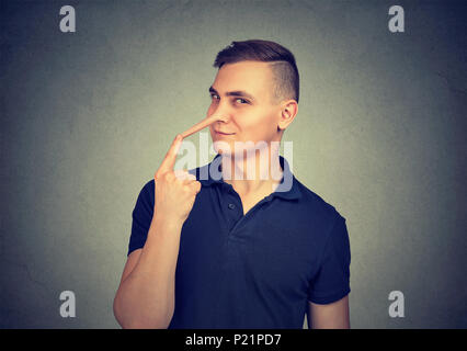 Sly man with long nose. Liar concept. Stock Photo