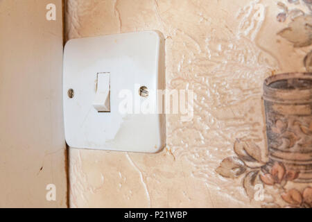 Dirty light switch in an old fashioned kitchen Stock Photo