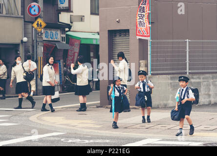 KYOTO,JAPAN, April 22, 2017: Japanese young students are coming back from elementary school in Kyoto, Japan. Stock Photo