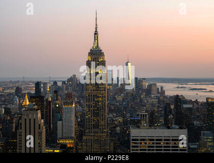 Sunset over the Empire State Building, World Trade Center and Manhattan skyline from the Top of The Rock, New York, USA Stock Photo