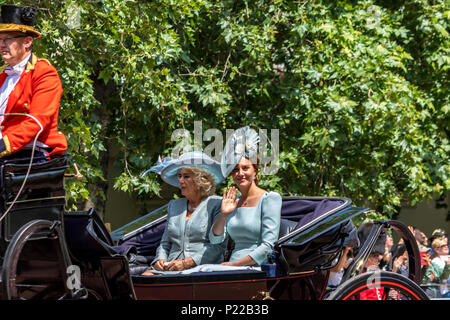 The Duchess Of Cambridge and The Duchess Of Cornwall riding in a carriage waving at crowds on The Mall at Trooping The Colour  ,London, UK,  2018 Stock Photo