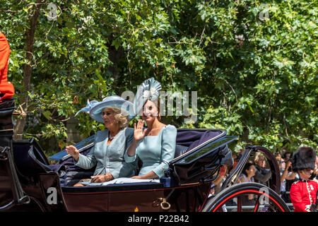 The Duchess Of Cambridge and The Duchess Of Cornwall riding in a carriage waving at crowds on The Mall at Trooping The Colour  ,London, UK,  2018 Stock Photo